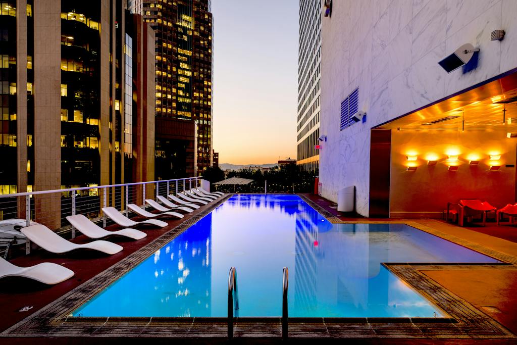 White Sunloungers Beside Pool luxury