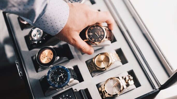 Person Holding Round Gold-colored Analog Watch With Link Bracelet