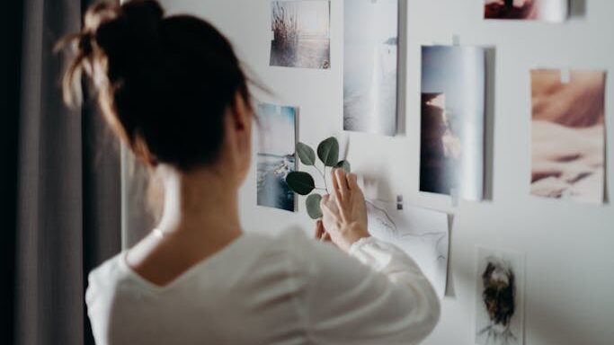 Woman Putting Photo on Wall
